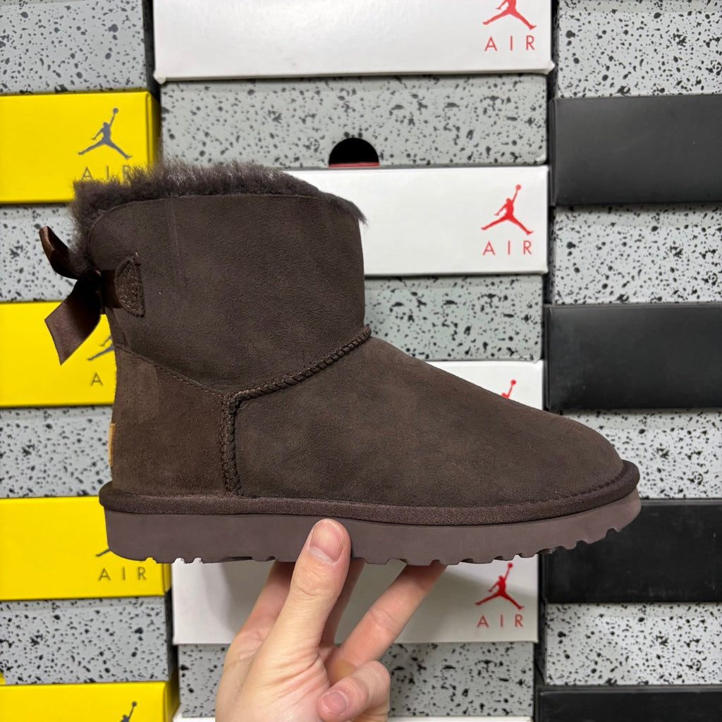 UGG Mini Bailey Bow Ankle Boot – Suede Boot with Tonal Dark Shearling Lining, Chocolate Satin Bow & Dark Sugar Sole in Chocolate